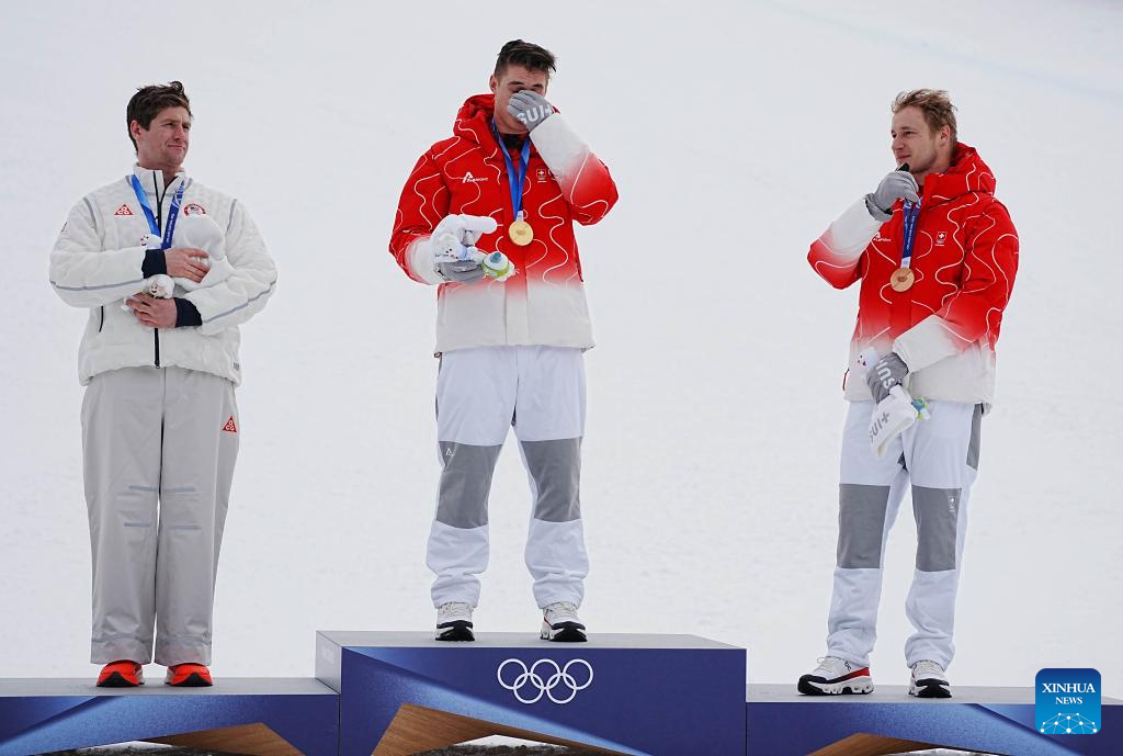 Alpine skier Von Allmen claims super-G gold to complete Milan triple